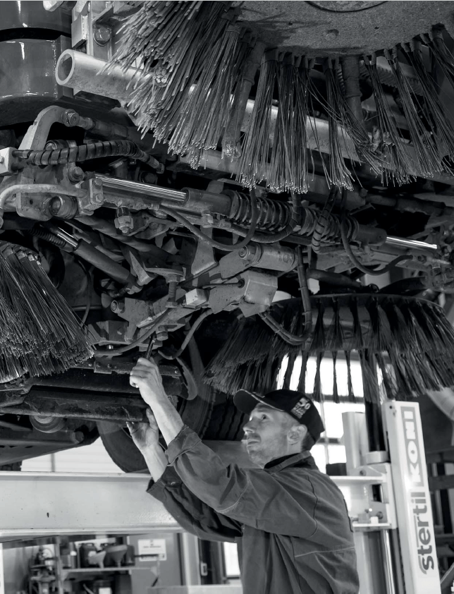 Parts Technician working on a Sweeper Truck