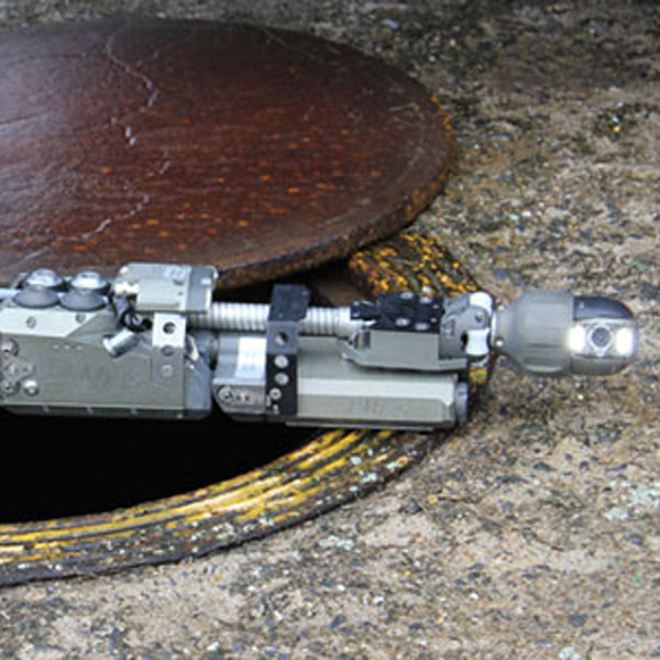 Rausch Lateral Launch System across a manhole opening